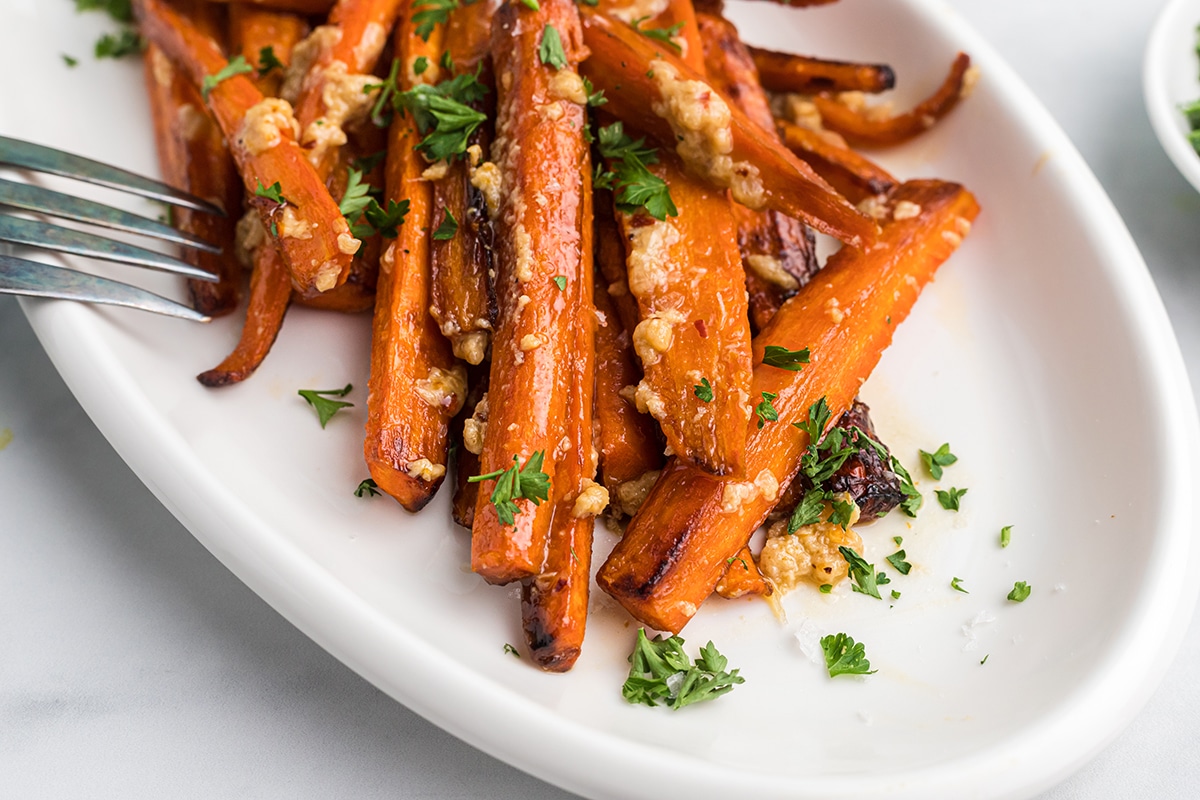 close up of cooked carrots in brie sauce