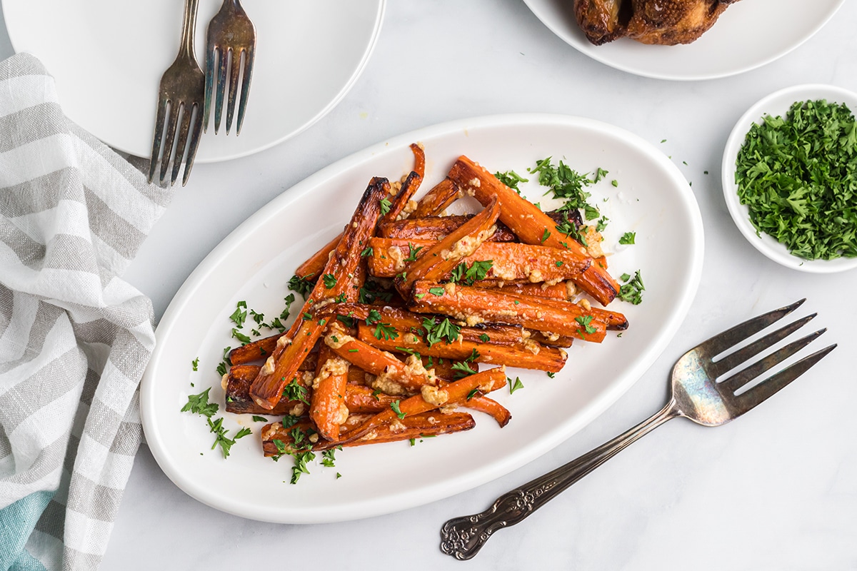 overhead of cooked carrots in brie sauce in a serving dish