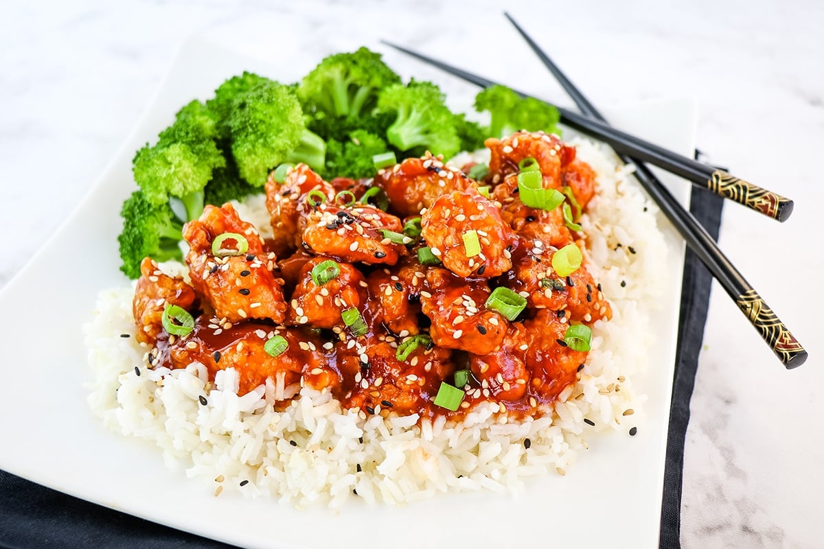 sesame chicken over a bed of rice