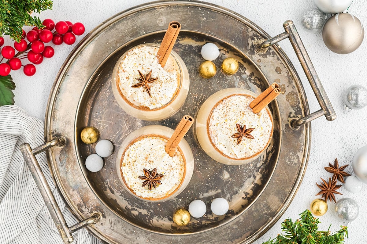 overhead shot of glasses of eggnog on a tray