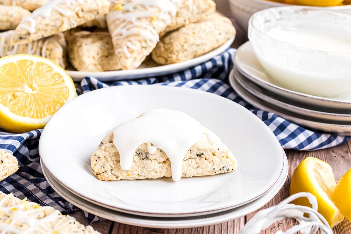 one scone on a plate with glaze