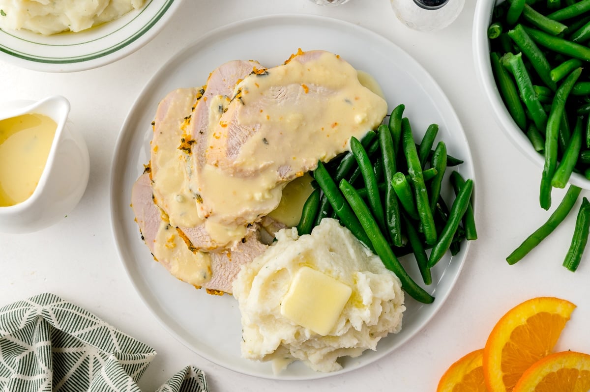 orange sage turkey breast with mashed potatoes and green beans