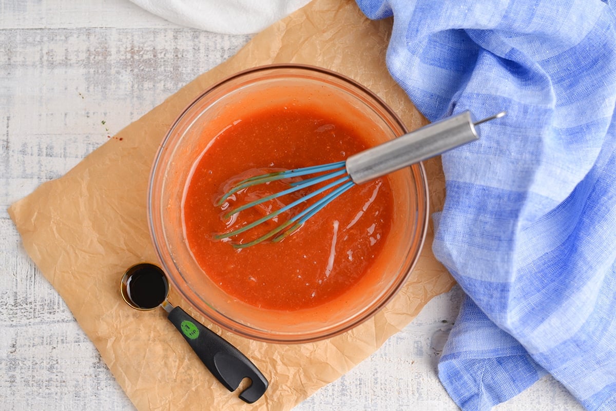 overhead of whisking together sauce for steak