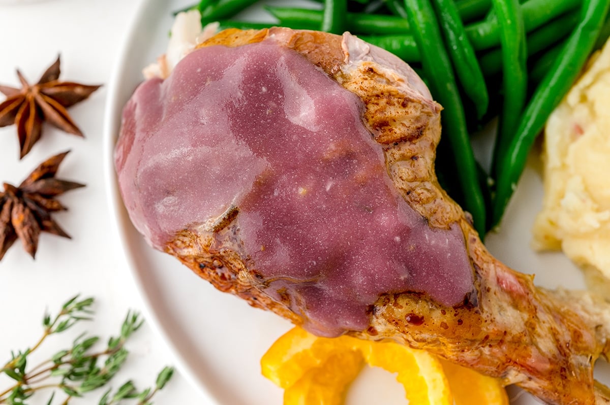 turkey leg topped with red wine gravy