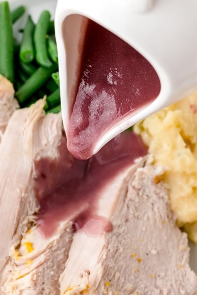 gravy pouring over turkey breast