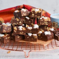 pile of fudge on a bronze cooling rack