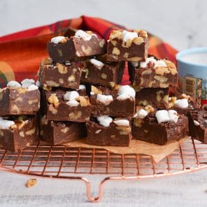 pile of fudge on a bronze cooling rack