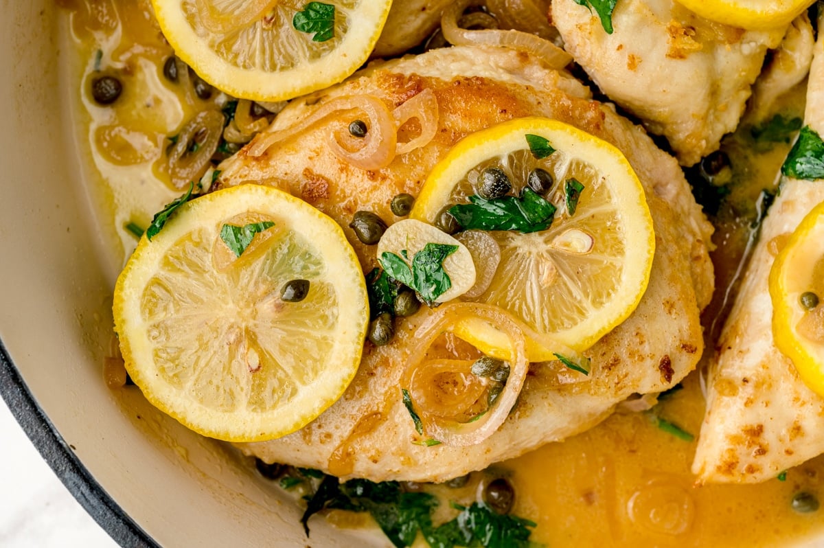 close up of chicken cutlets with piccata sauce