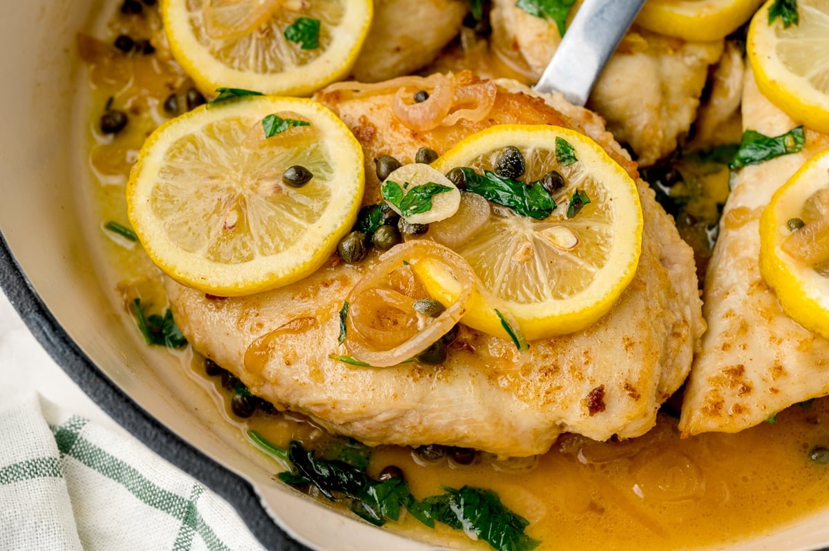 angle view of chicken in piccata sauce