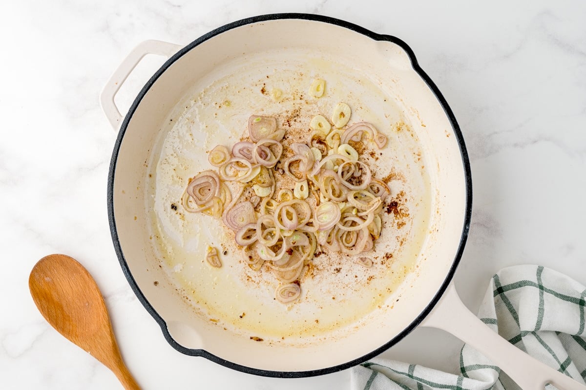 shallots and garlic in a frying pan