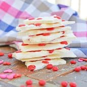 stack of cinnamon bark with red hot candies