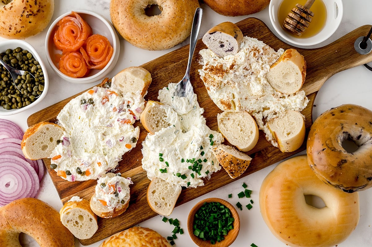 cream cheese board dipped into with bagels