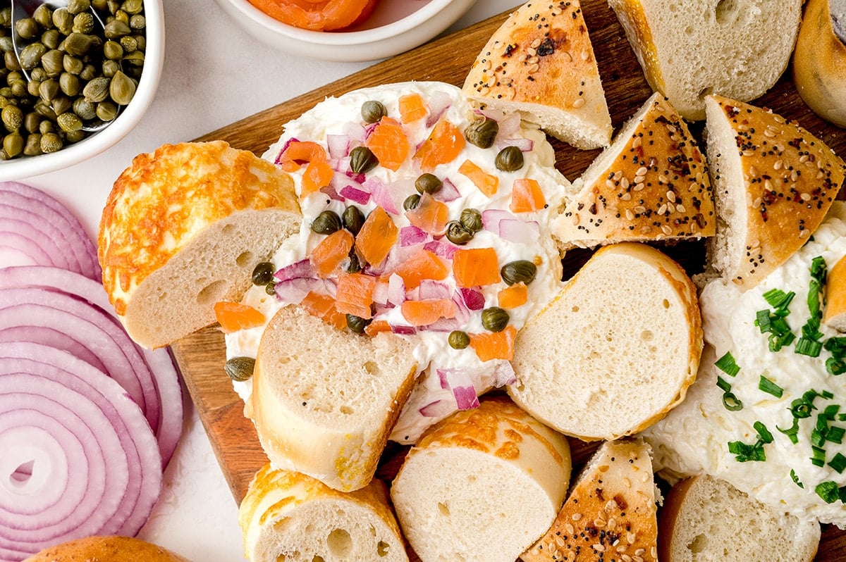 bagels dipping into lox cream cheese