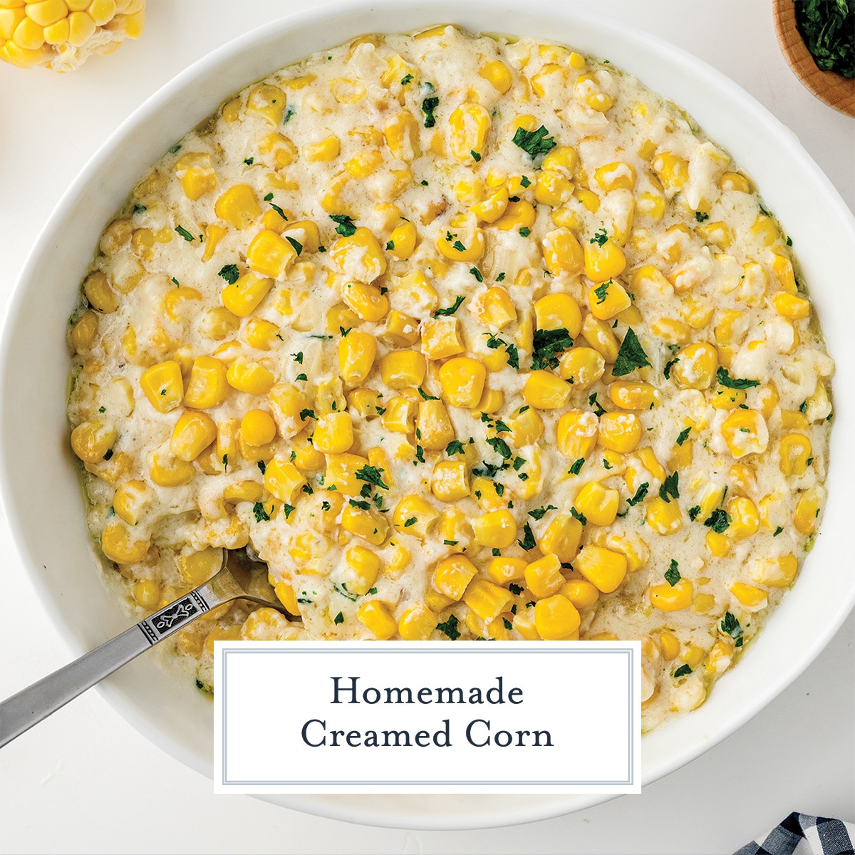 overhead of homemade creamed corn in a white serving bowl