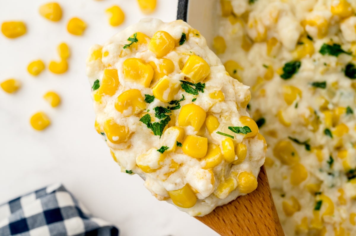close up of creamed corn on a spoon