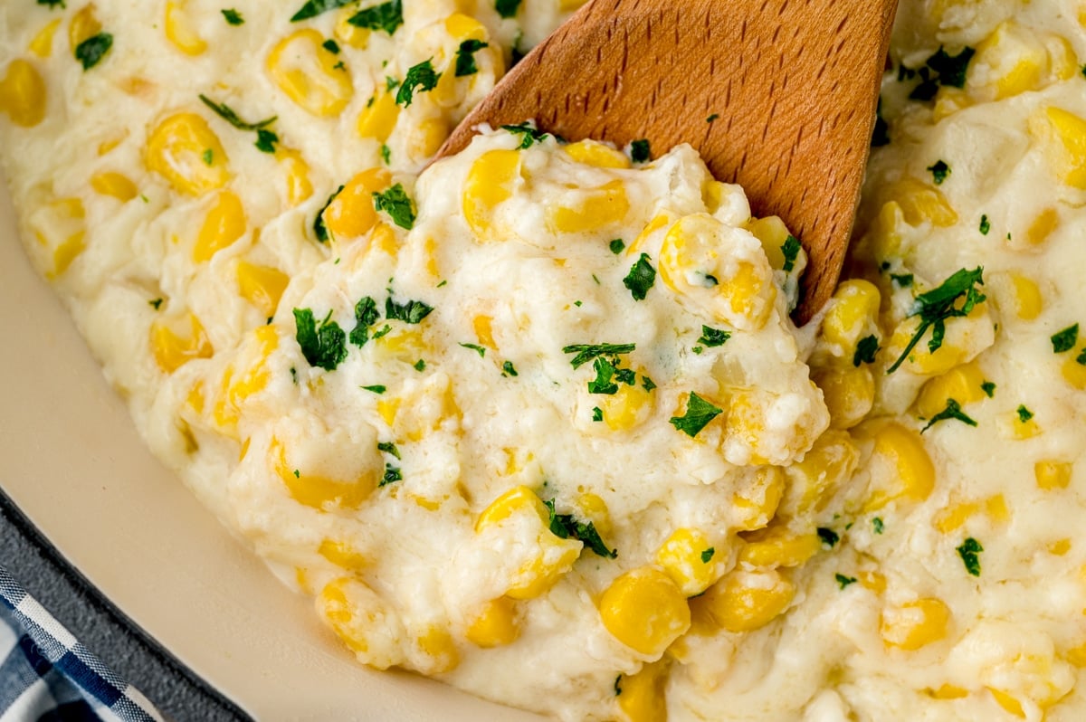 corned corn on a wood spoon