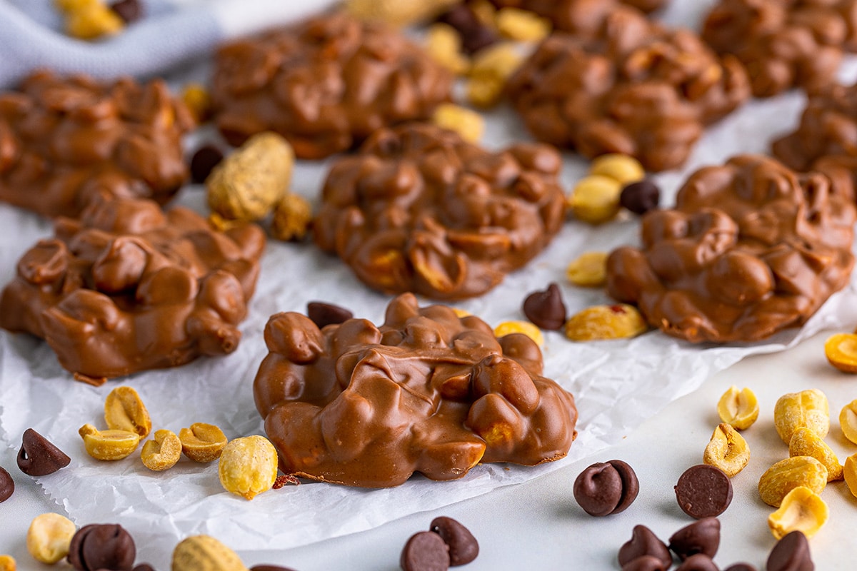 close up of peanut clusters on parchment paper