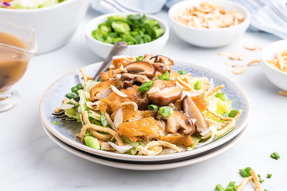 plate of detroit almond chicken over iceberg lettuce