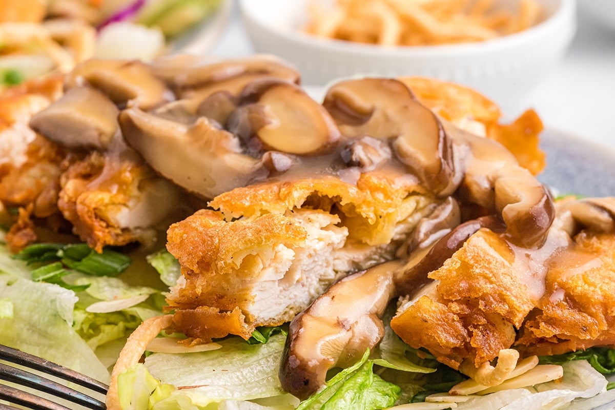 close up of sliced fried chicken