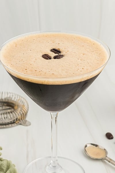 espresso martini with shaker in background