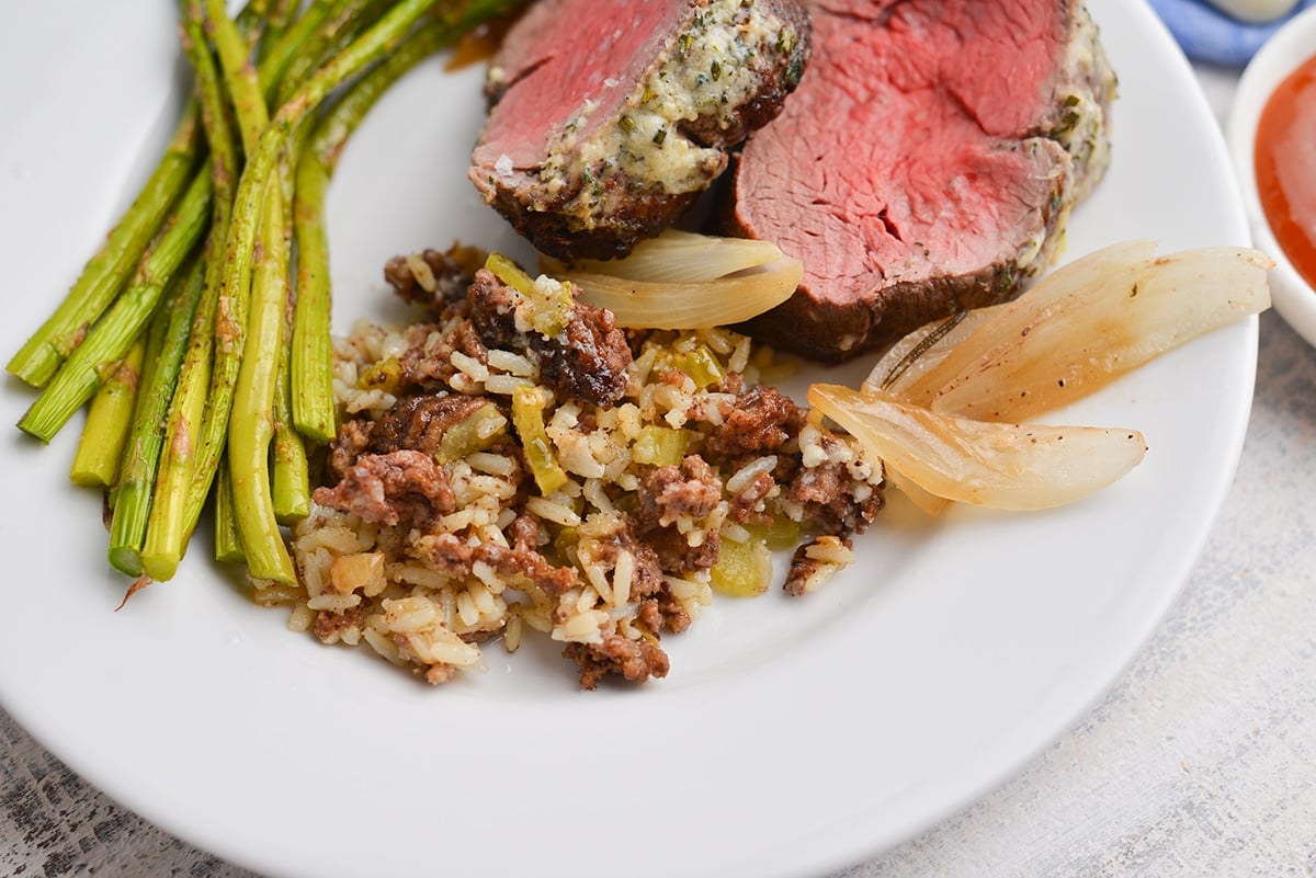 rice dressing on a plate with veggies and meat