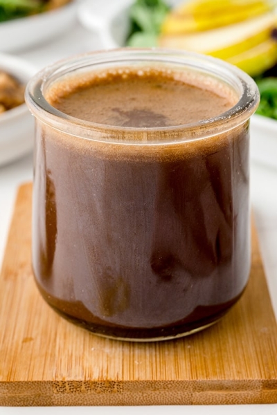 angled shot of jar of honey balsamic dressing