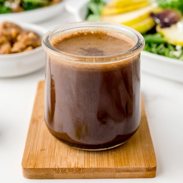 angled shot of jar of honey balsamic dressing