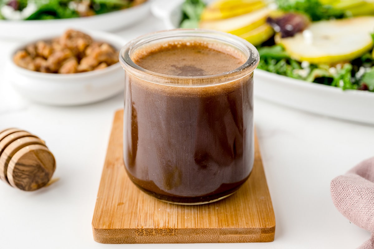 angled shot of jar of honey balsamic dressing