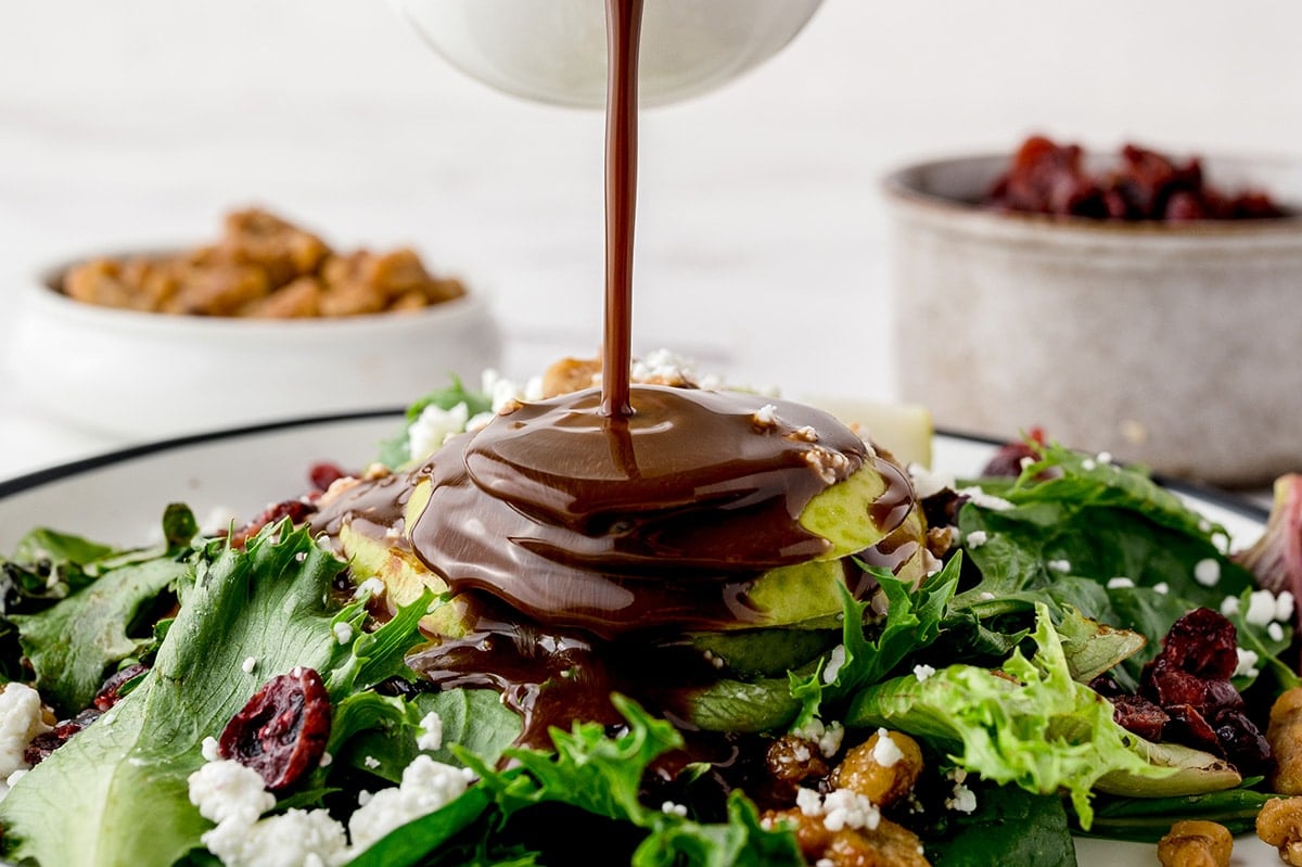 dressing poured onto salad