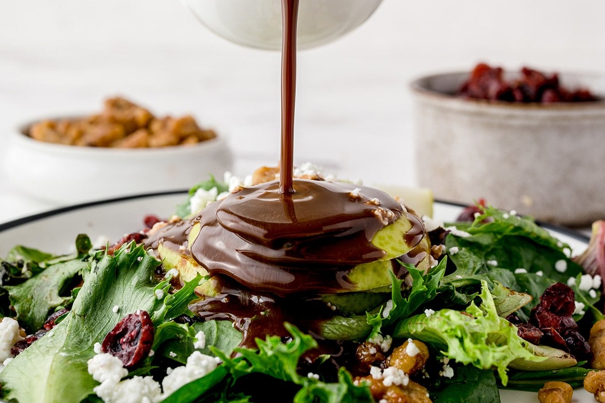 dressing poured onto salad