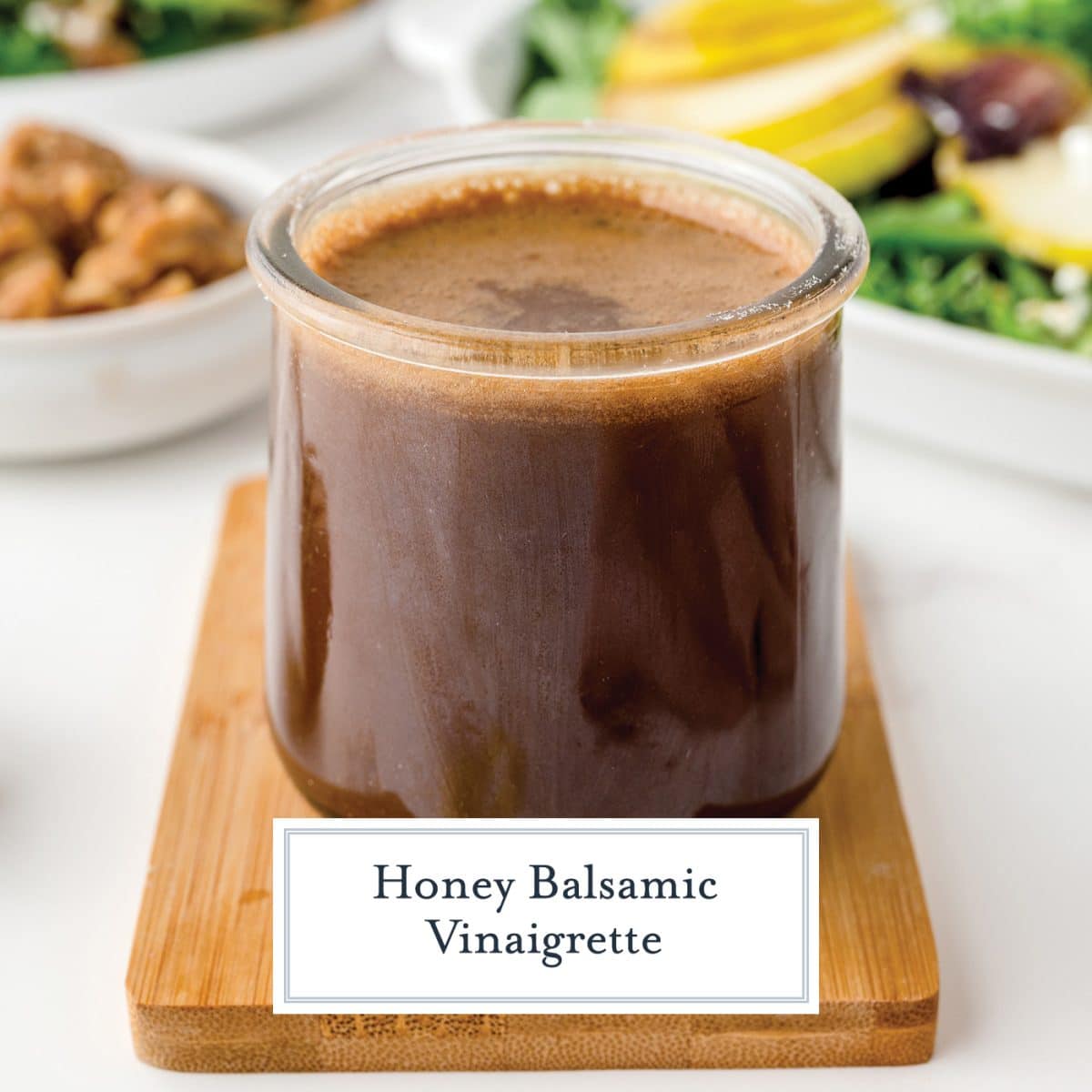 angled shot of honey balsamic vinaigrette with text overlay for facebook