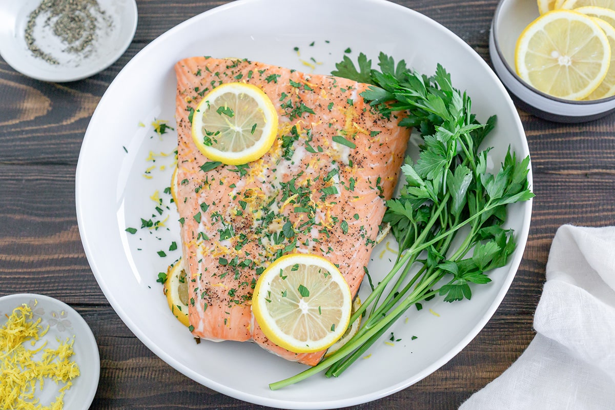 lemon pepper salmon on a white plate