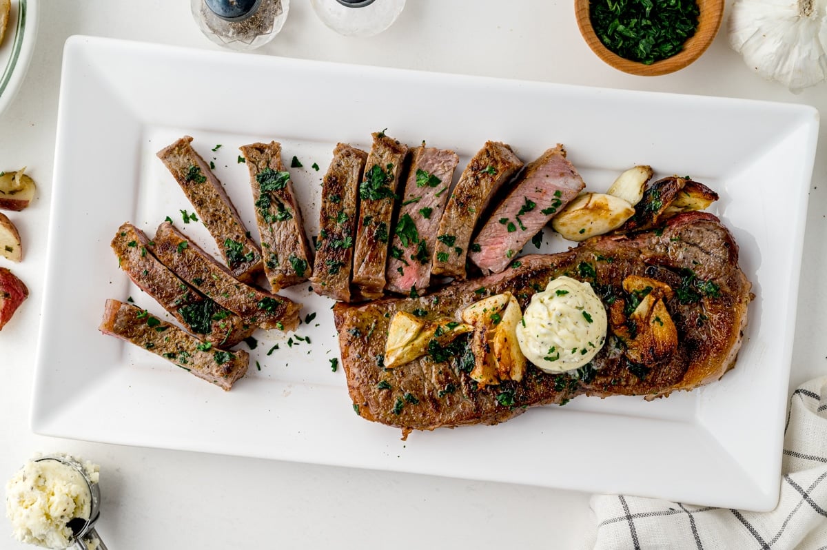 sliced steak on a serving platter