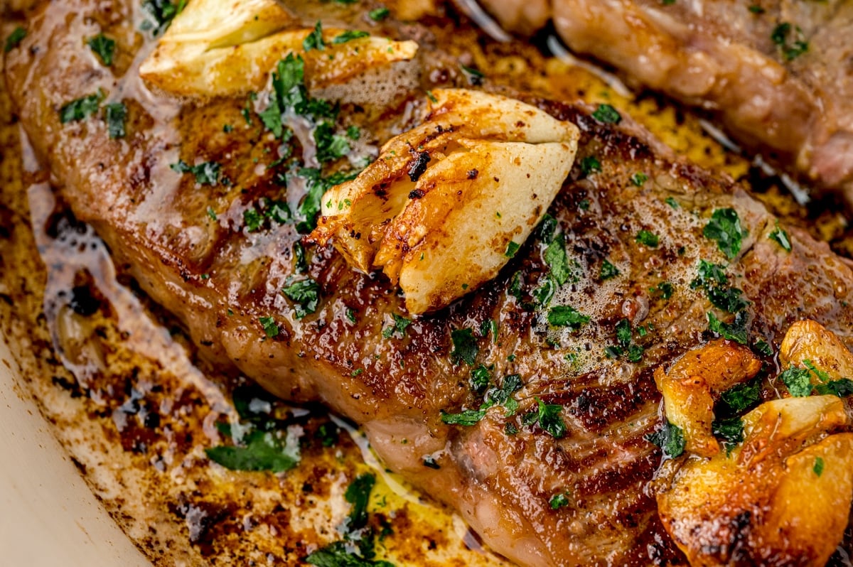 close up of garlic on a steak