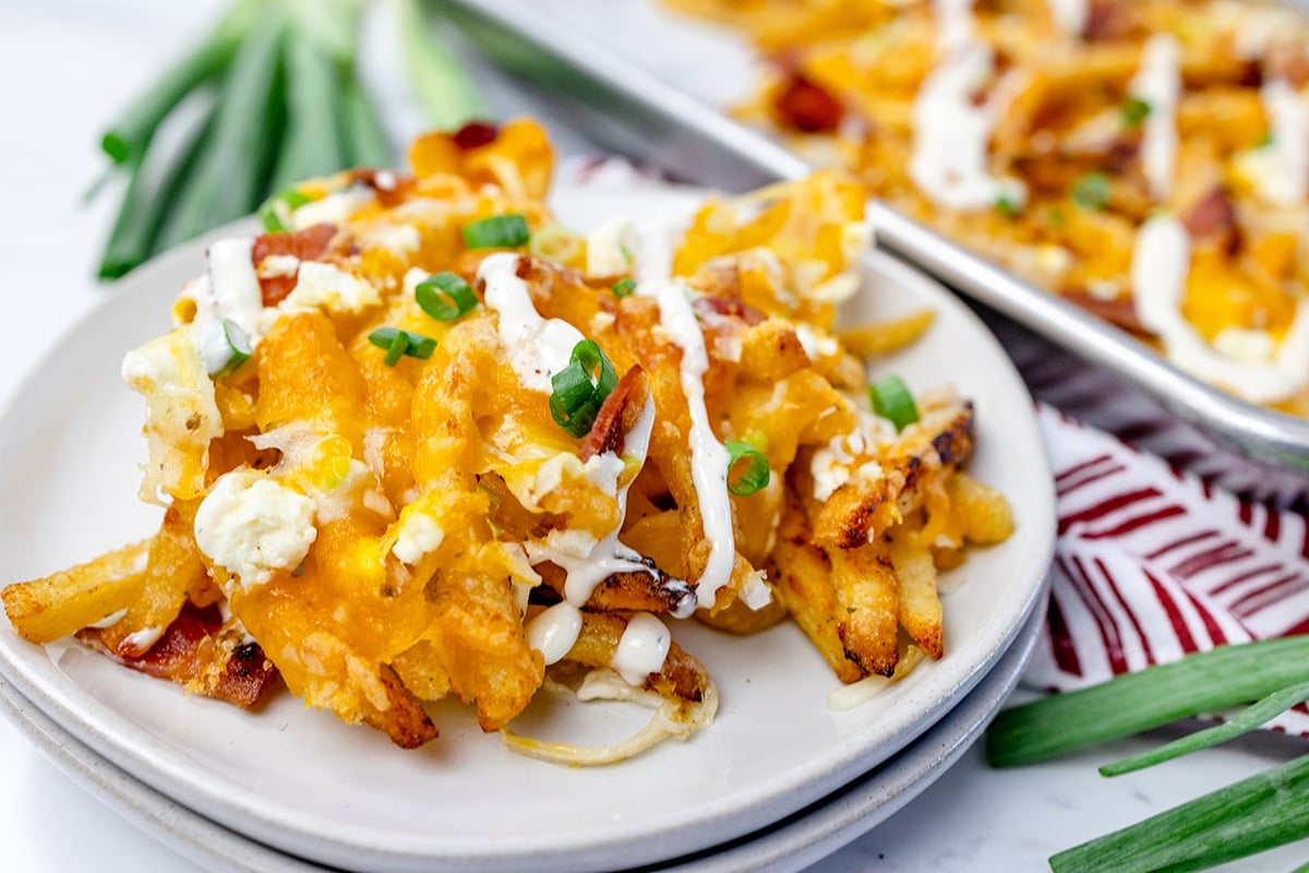 straight on shot of cheese fries on a plate