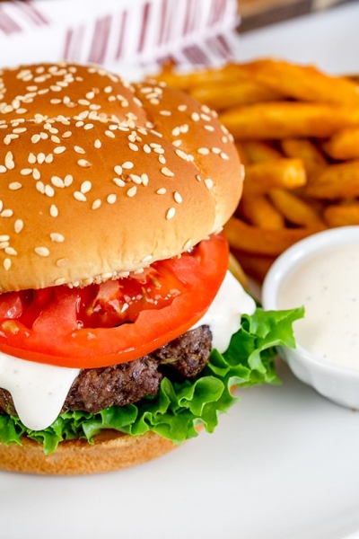 ranch burger on a plate with fries