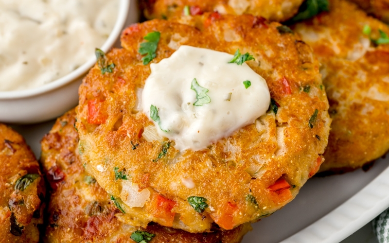 salmon pattie with white creamy sauce on top