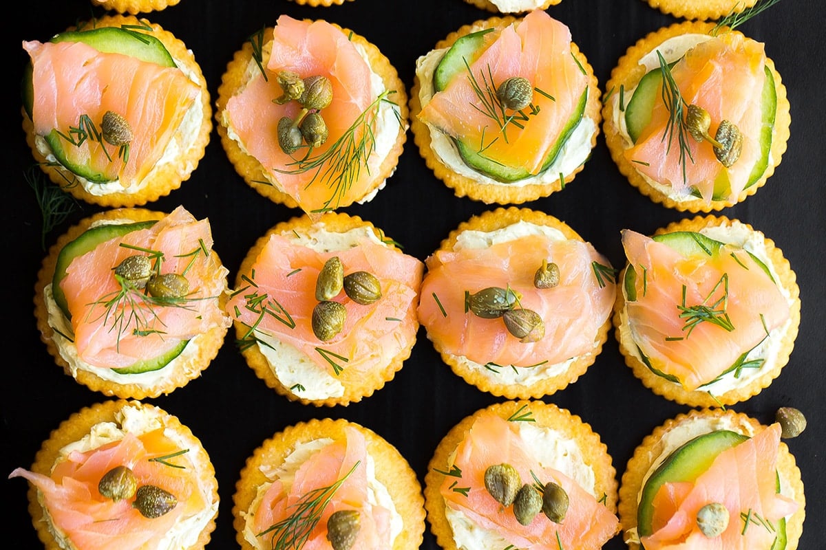 overhead of smoked salmon crackers