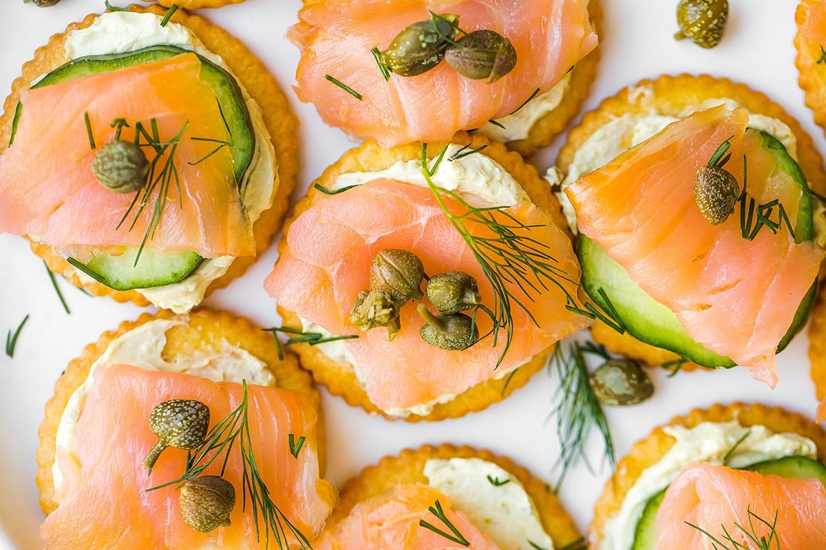 close up of smoked salmon crackers with capers