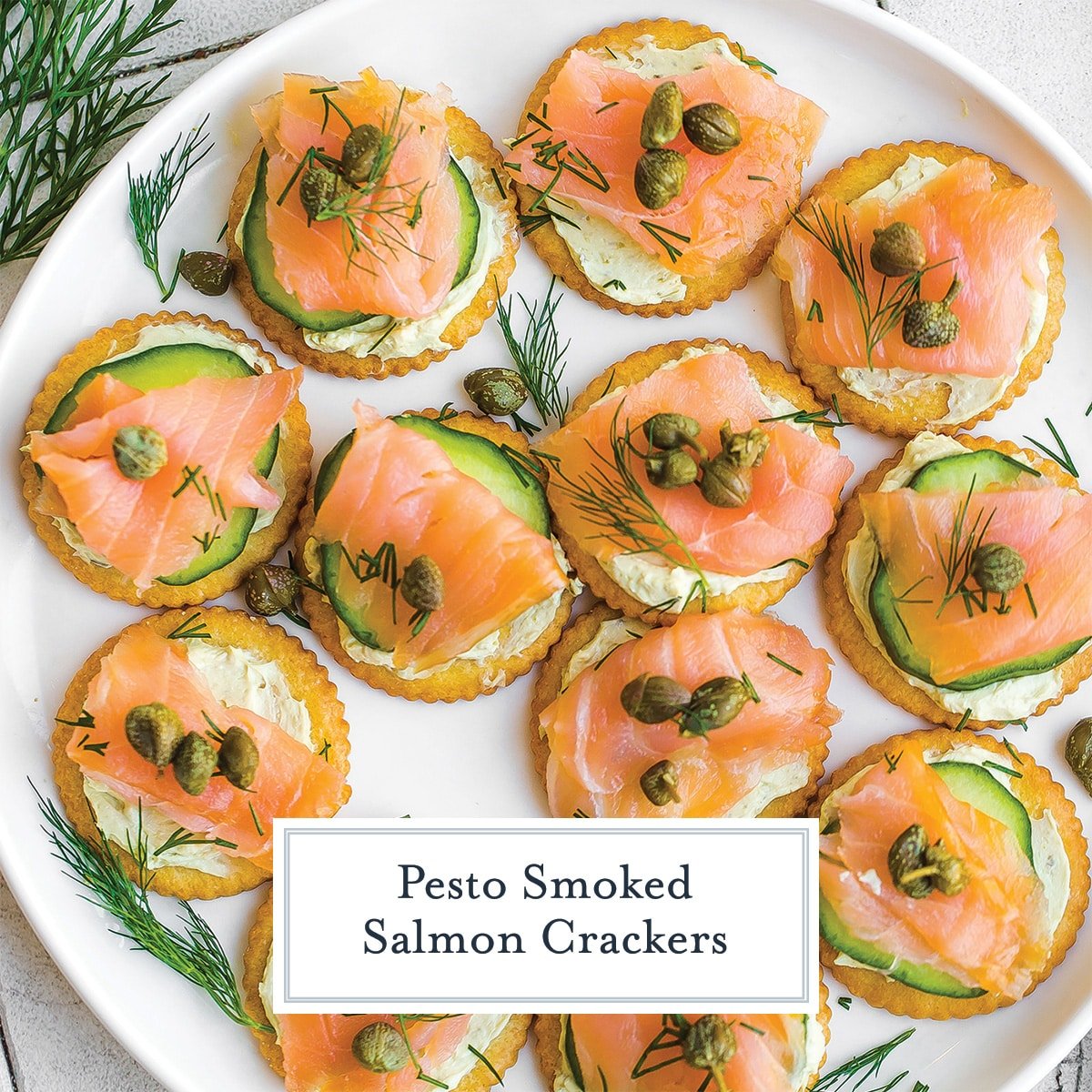 smoked salmon crackers on a white plate with text overlay