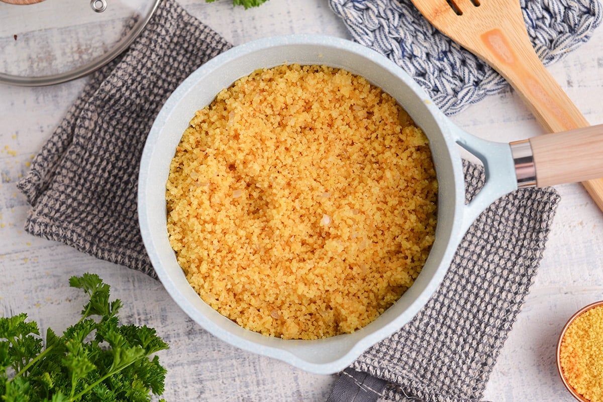 overhead of cooked couscous in a small saucepan