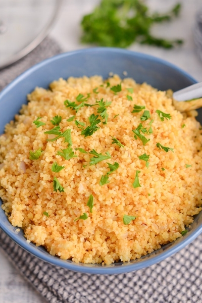 blue serving bowl of couscous