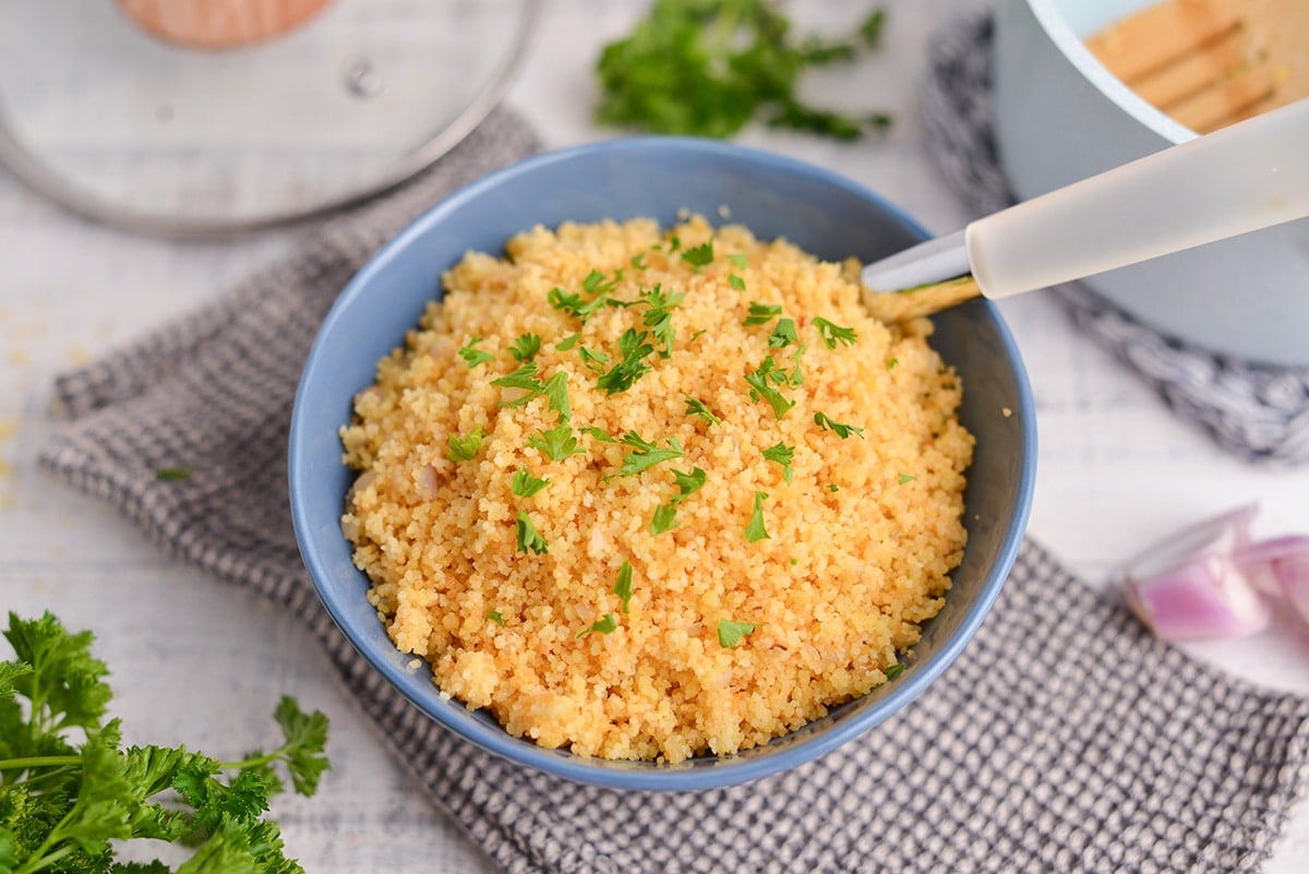 blue serving bowl of couscous