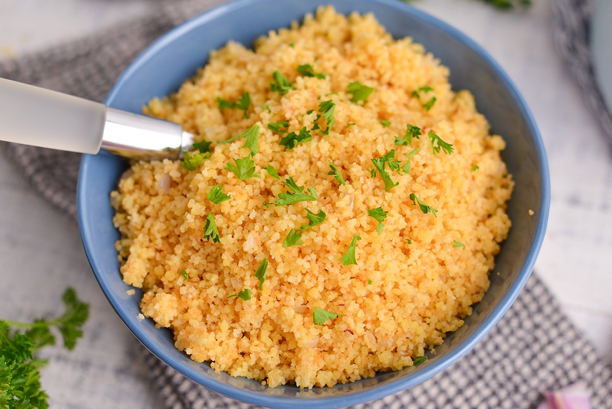 spoon in a bowl of small couscous