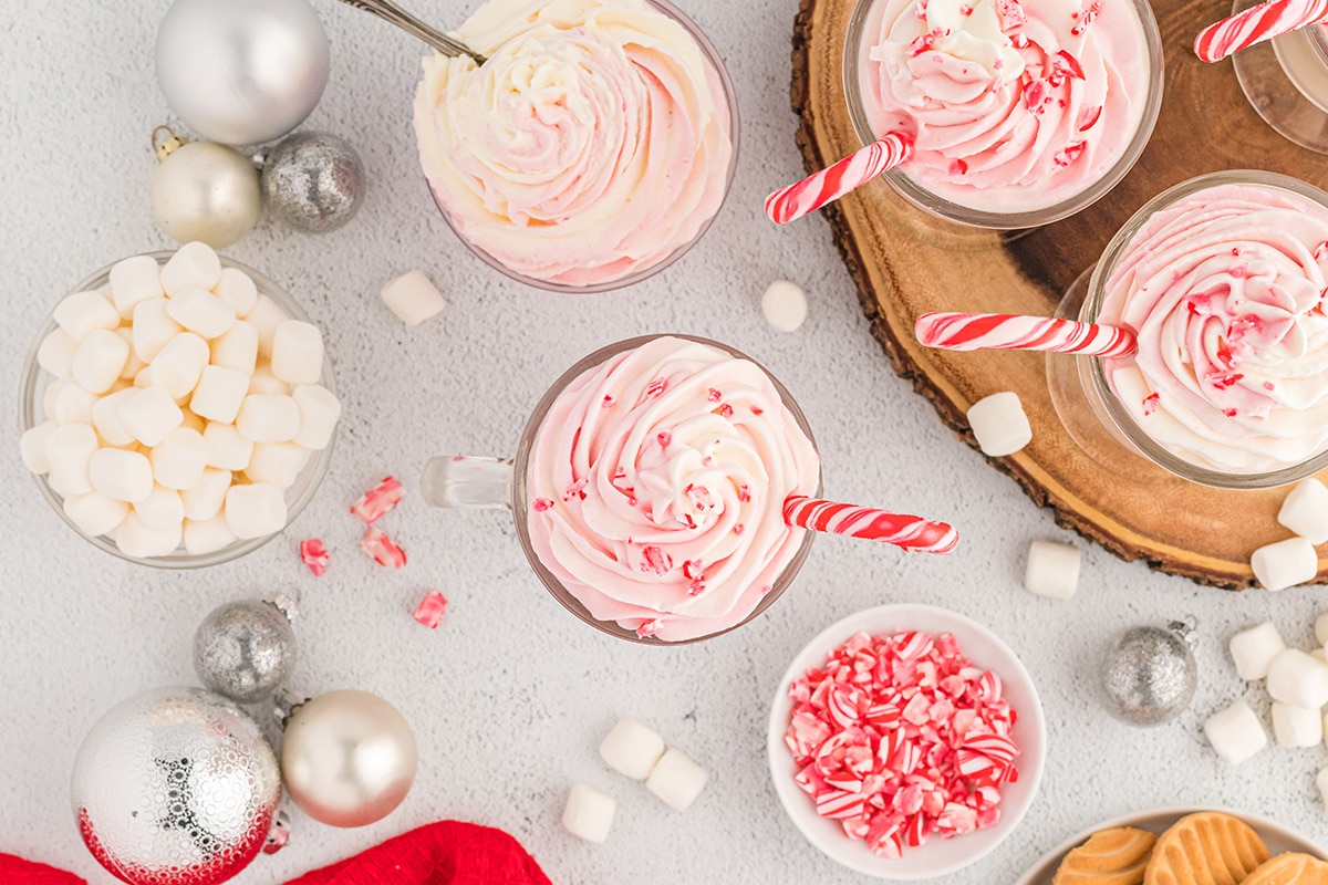 overhead of white chocolate drinks with peppermint whipped cream