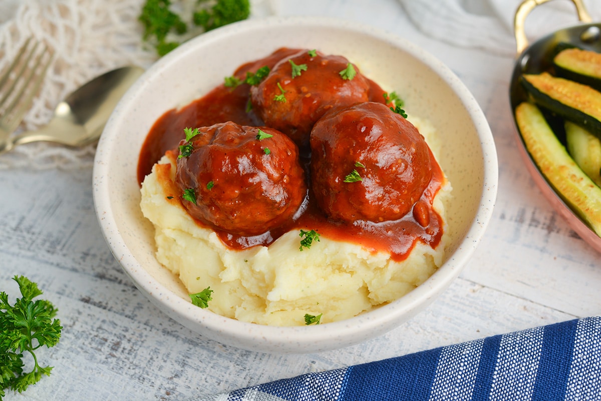 angle view of meatballs over mashed potatoes
