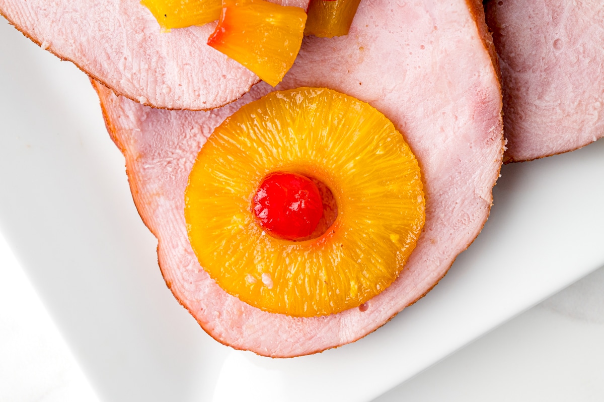 slice of ham with pineapple and cherry