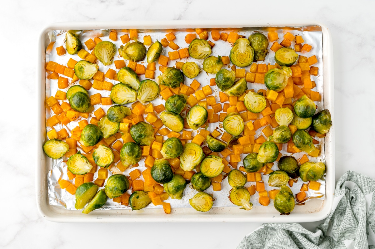 brussels sprouts and butternut squash on a sheet pan