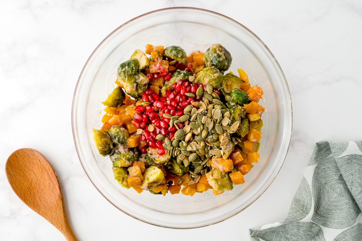 brussels sprout salad ingredients in a bowl