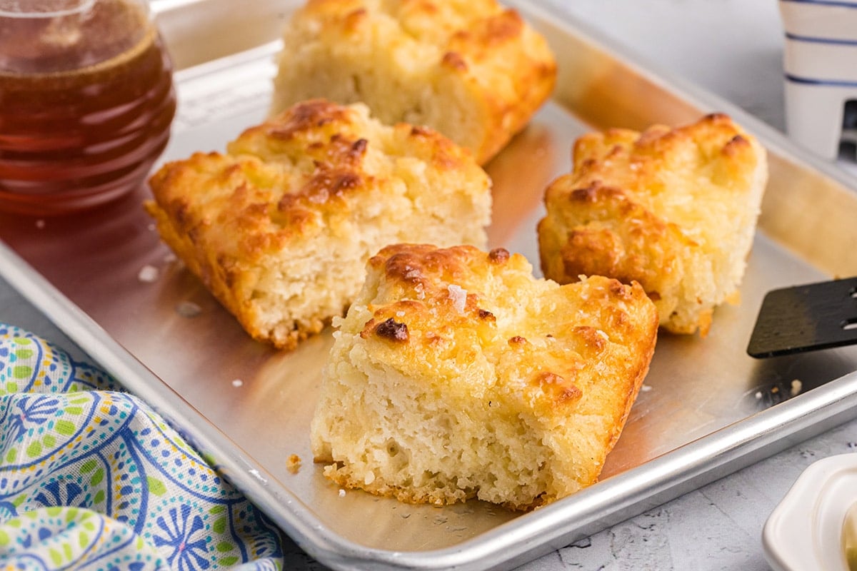 cut biscuits on a metal sheet tray